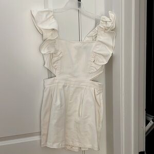 White romper with cutouts, denim.